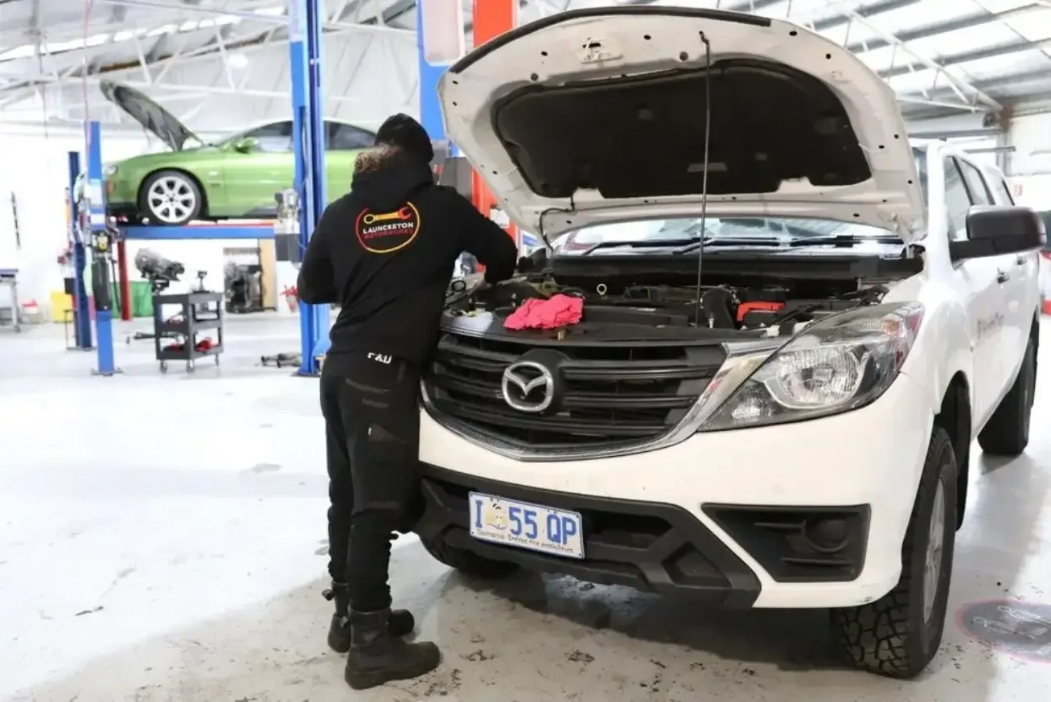 Mechanic servicing a Mazda BT-50 ute at the Launceston Motorworks workshop