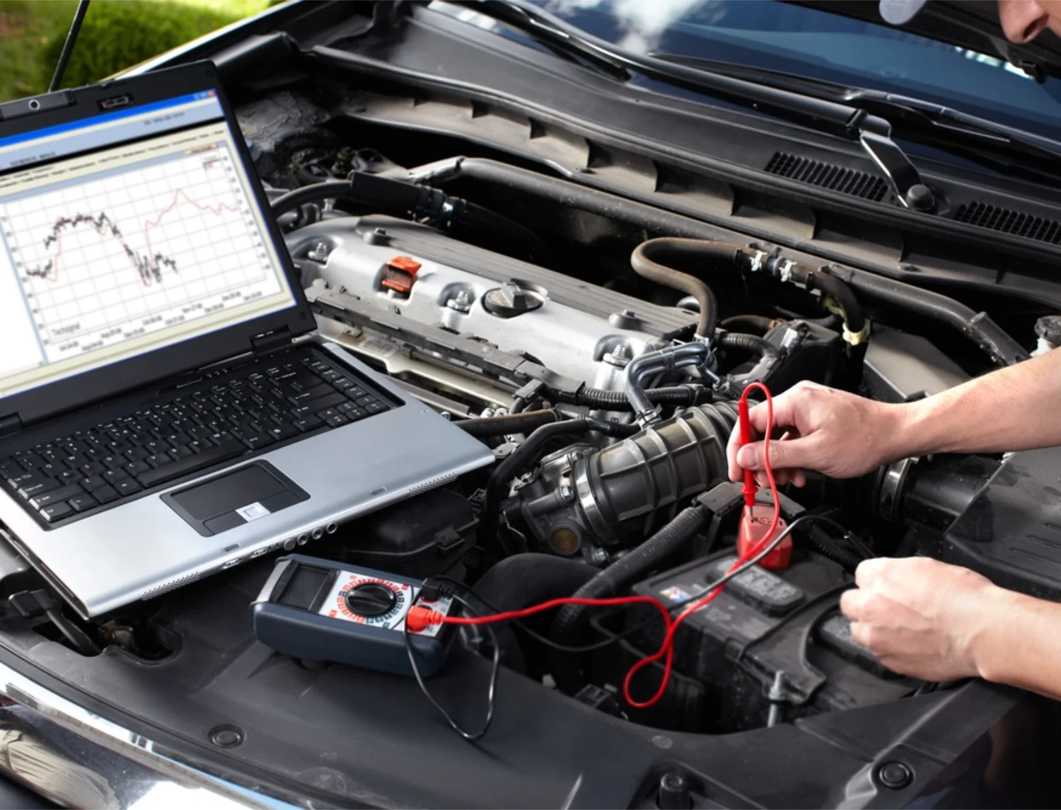 Mechanic using a multimeter to test vehicle electrical systems